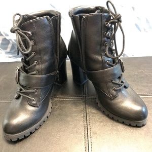 Black Vera Wang high heel leather boots.